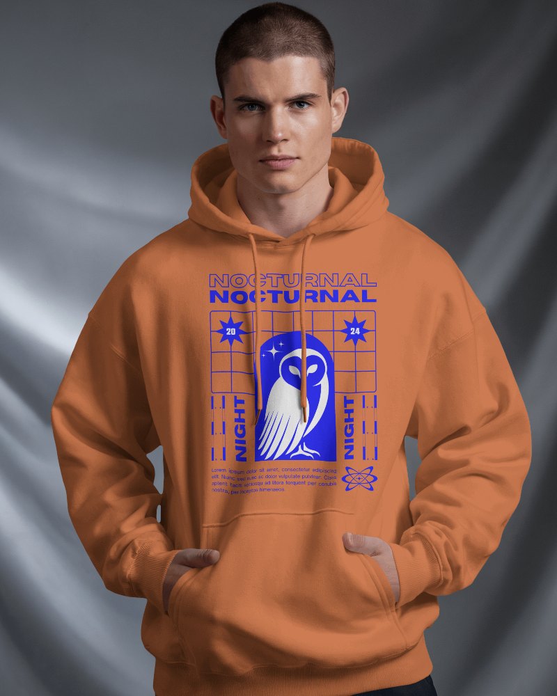 Striking Nocturnal Hoodie Mockup Male With Owl And Star Graphic Under Intense Shadows