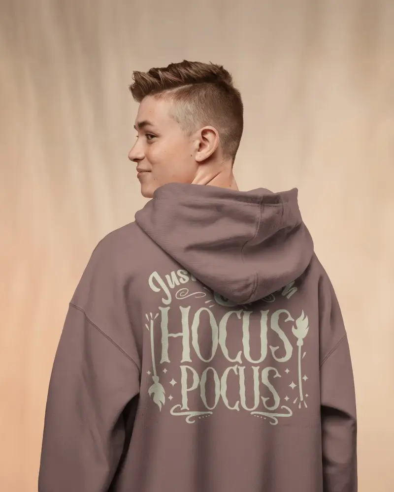 Back View Hoodie Mockup With Smiling Young Male Model In Soft Studio Lighting And Neutral Background