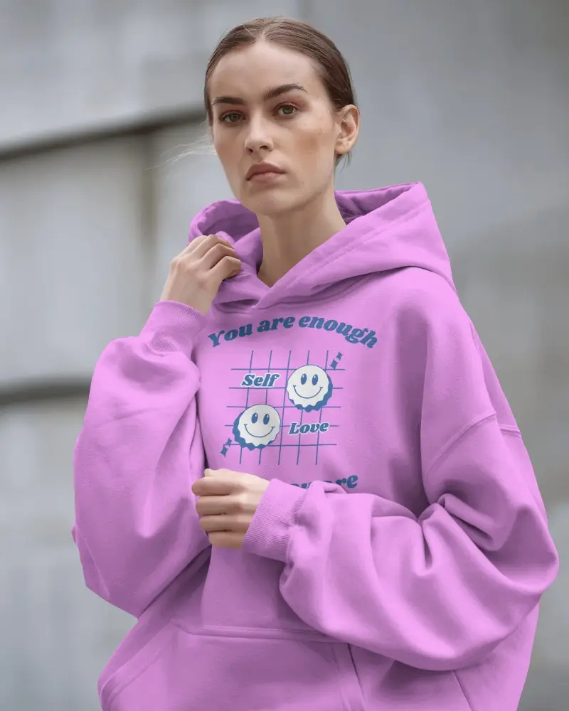 Streetwear Hoodie Mockup Featuring Confident Woman In Relaxed White Hoodie Against Architectural Backdrop