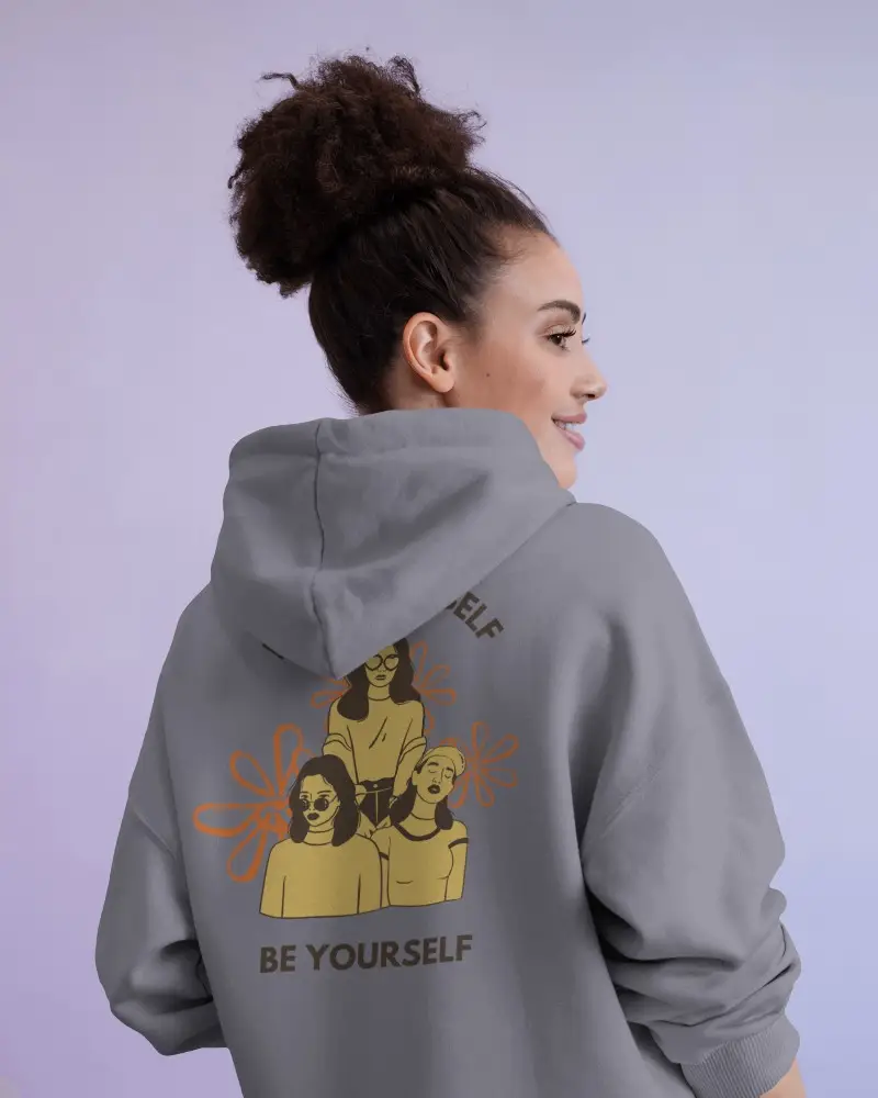 Pastel Studio Hoodie Mockup With Smiling Female Model Showing In Light Purple Background