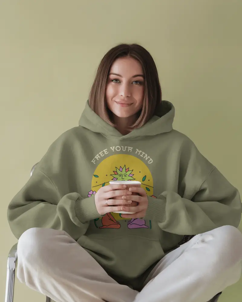Peaceful Vibe Hoodie Mockup Female Model In Relaxed Fit Hoodie On Muted Green Backdrop