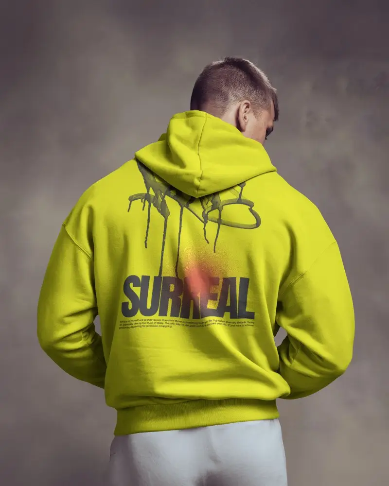 Soft Studio Hoodie Mockup Back View Male Model In Hoodie Looking Away Moody Lighting
