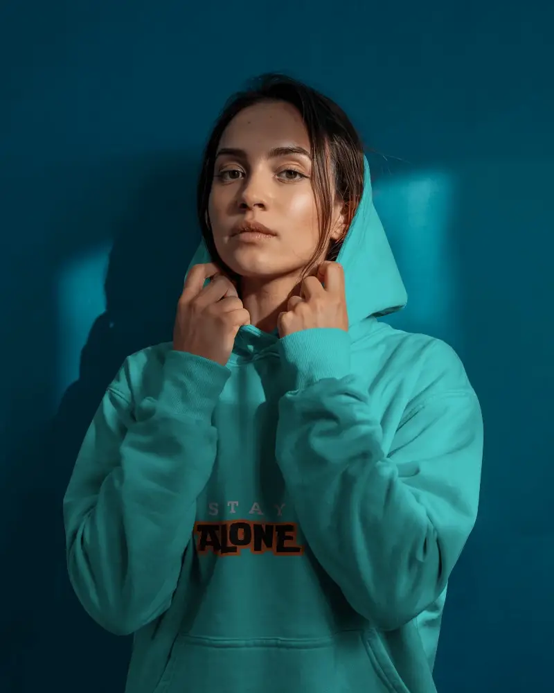 Bold Female Portrait Hoodie Mockup In Studio Lighting Against Deep Teal Background Modern And Minimalist Fashion Scene 0522