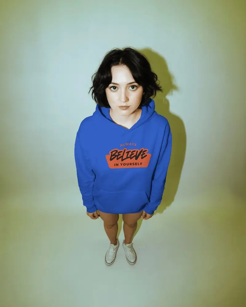 Sculptural Oversized Hoodie Mockup Draped On Pedestal As Wearable Art Gallery Lighting With Dramatic Shadow Play