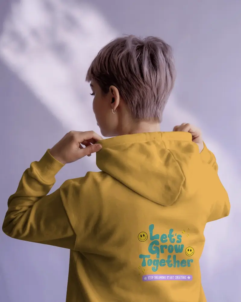 Hoodie Mockup With Back Design And Female Model In Bright Interior Under Subtle Shadow Light Play 0529