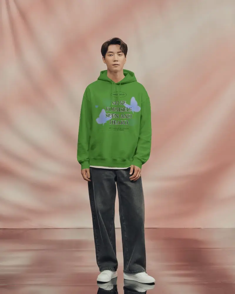 Clean White Hoodie Mockup On Modern Asian Male Model With Soft Blurred Background Perfect For Minimalist Branding And Apparel Launches