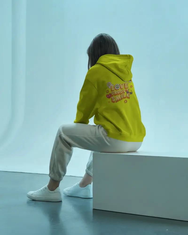 Back View Hoodie Mockup Female Model Seated On Bench Soft Blue Lighting Your Design Here Print