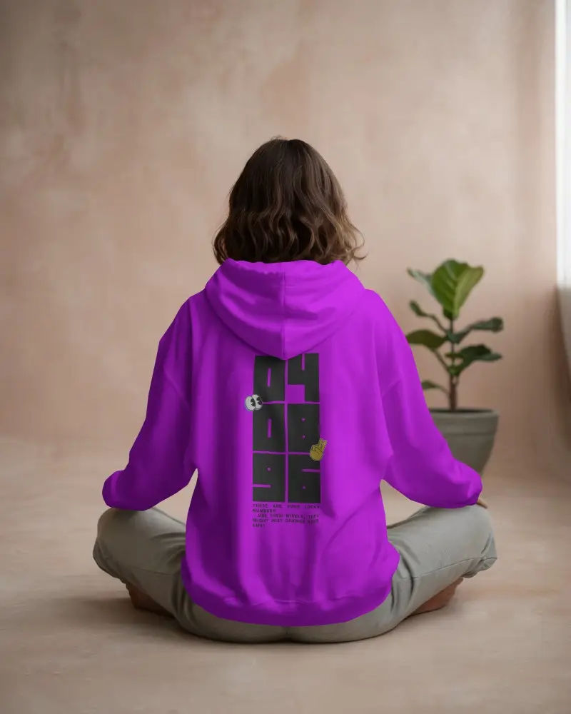 Back View White Hoodie Mockup Woman Sitting Cross Legged Neutral Toned Room Plant In Background Relaxed Natural Light Style