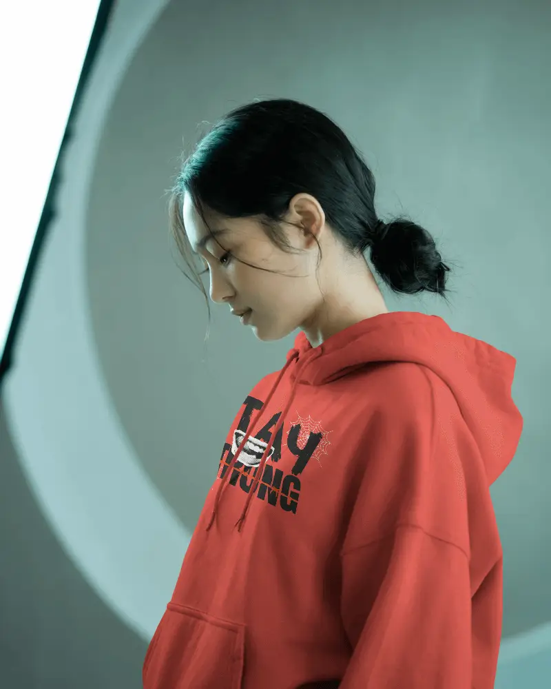 Thoughtful Female Model Wearing White Hoodie In Minimal Studio