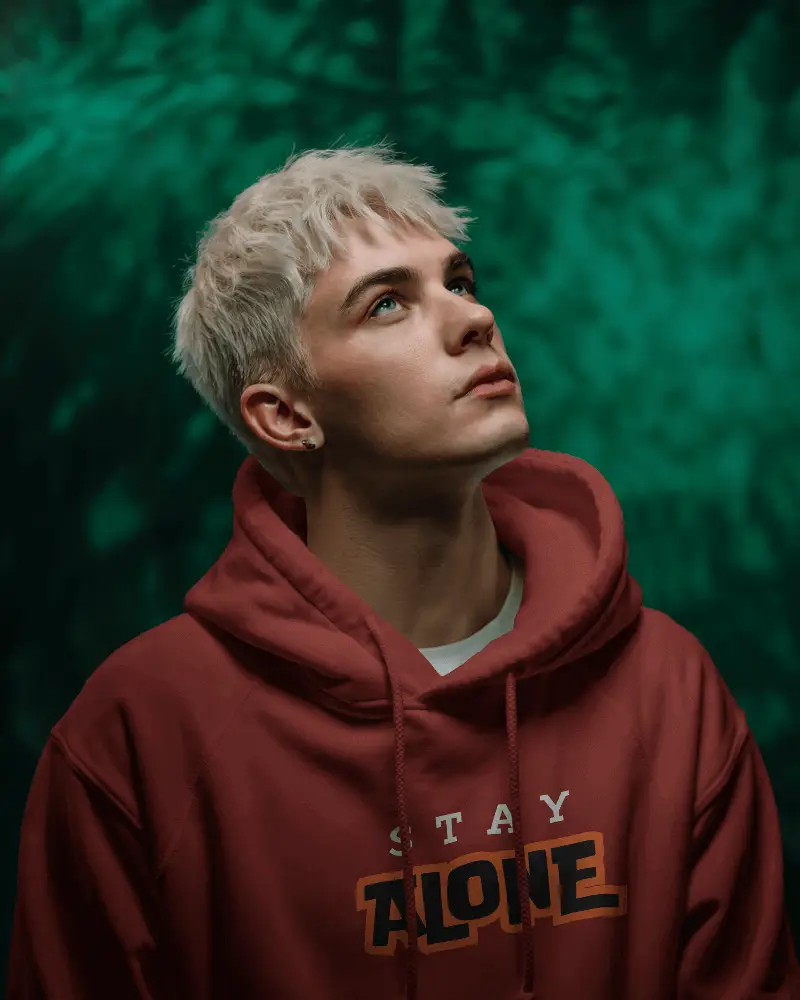 Fashion Forward Hoodie Template With Model Gazing Up Into Light