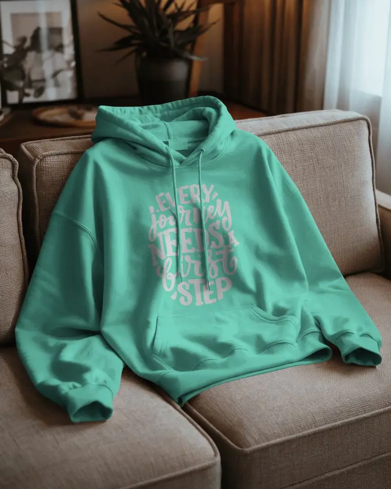 Cozy Living Room Hoodie Mockup White Sweatshirt Resting On Sofa With Soft Morning Light 0792