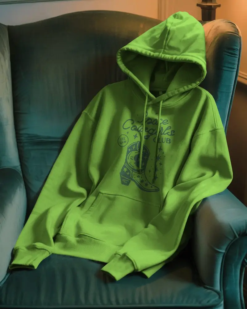 Cozy Interior Hoodie Mockup On Green Armchair Evening Lighting Comfortable Lifestyle Setting 0795