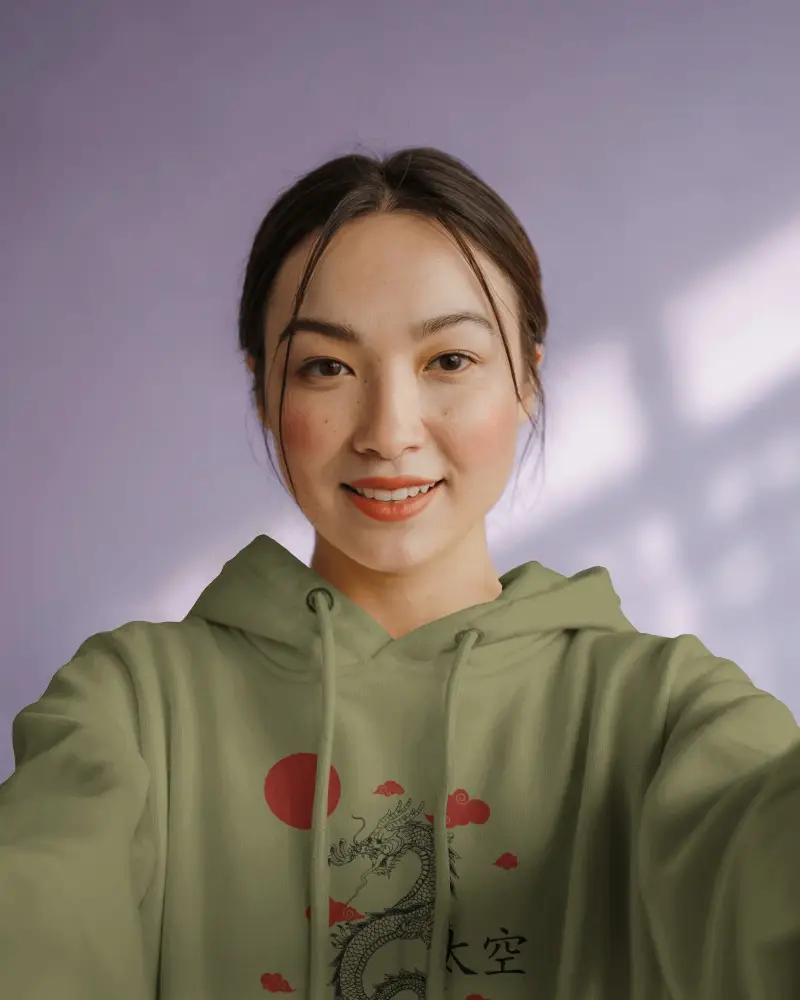 Smiling Female Hoodie Mockup Front View In Soft Daylight With Light Purple Wall Background