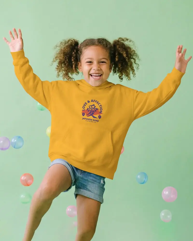 Playful Kids Hoodie Mockup With Cheerful Little Girl Jumping And Smiling In Casual Wear