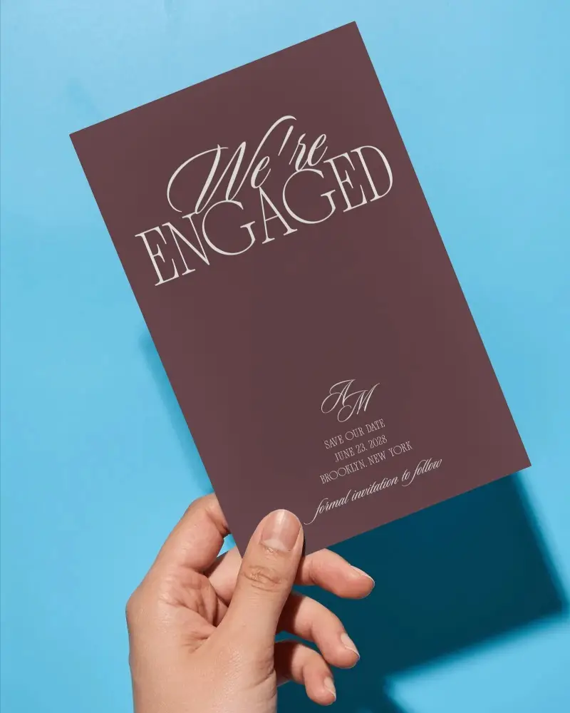 Hand Holding Blank Invitation Card Mockup On Solid Background For Design Display