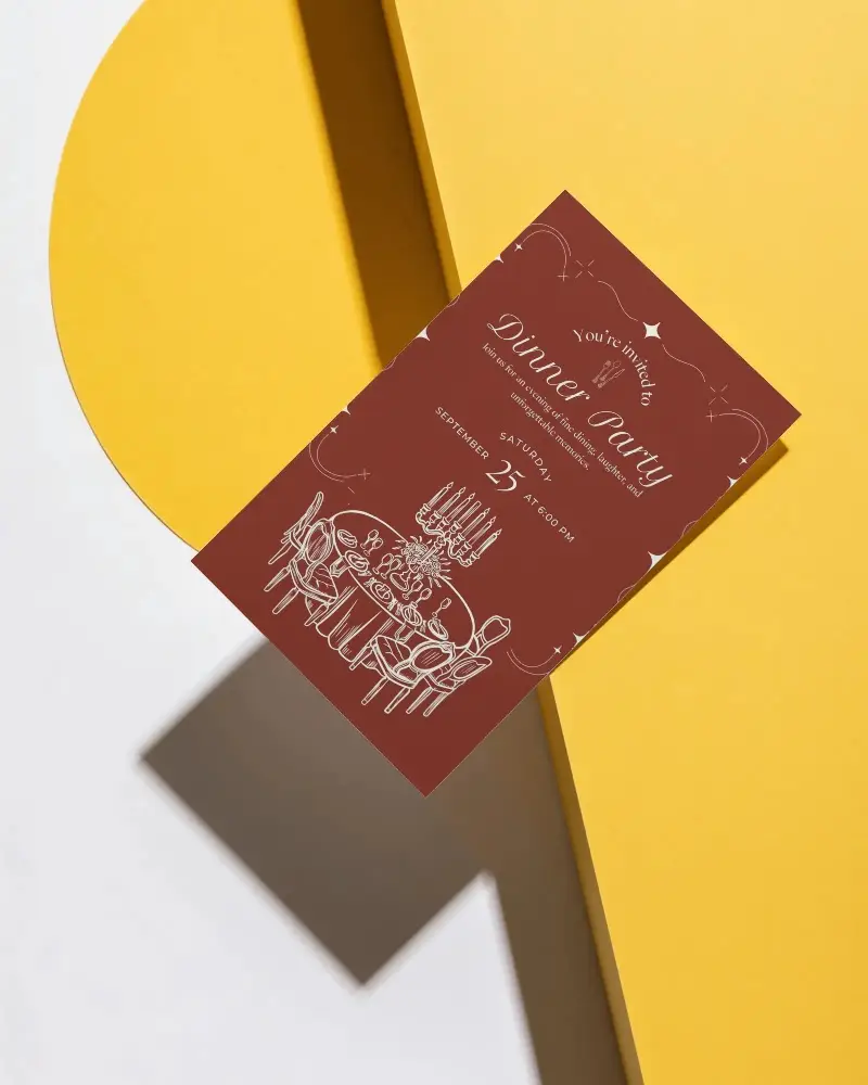 Sleek Modern Invitation Card Mockup On Abstract Yellow Shape With Contrasting White Surface