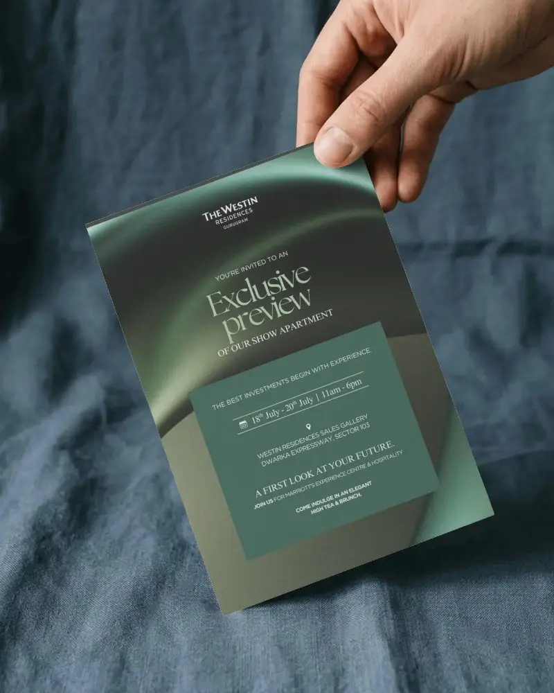 Hand Holding Blank Invitation Card Mockup Over Textured Fabric Background For Design Display