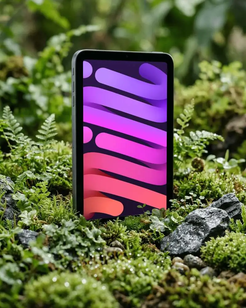 Responsive Ipad Mini Mockup Placed In Forest Setting For Modern App Showcase