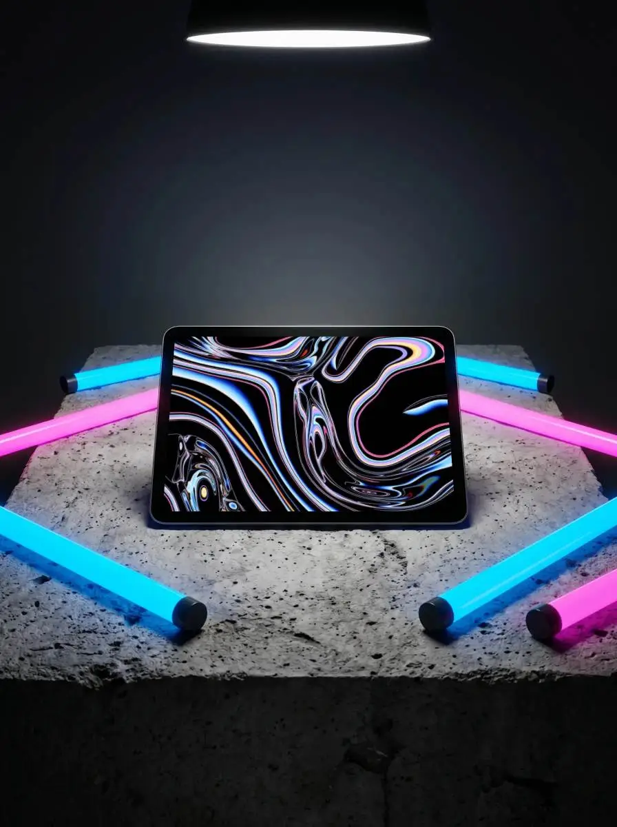 Modern Ipad Pro Mockup On Rough Stone Surface With Led Light Tubes In Dynamic Arrangement