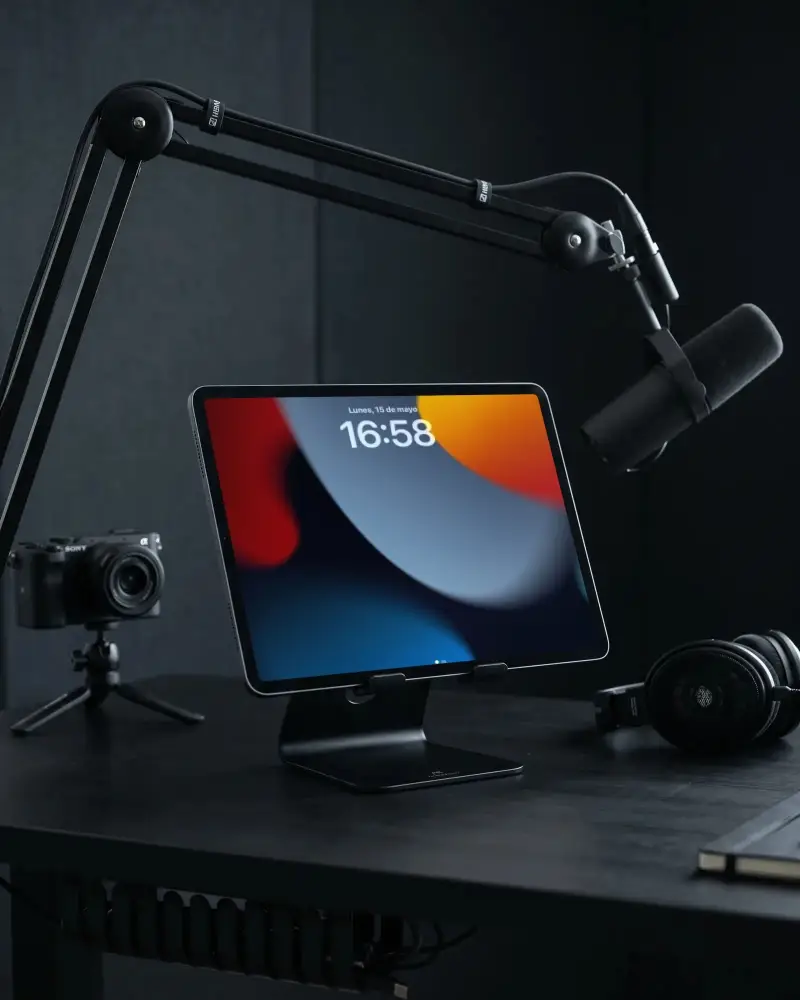 Professional Ipad Pro Mockup With Recording Microphone And Headphones On Dark Studio Desk Setup