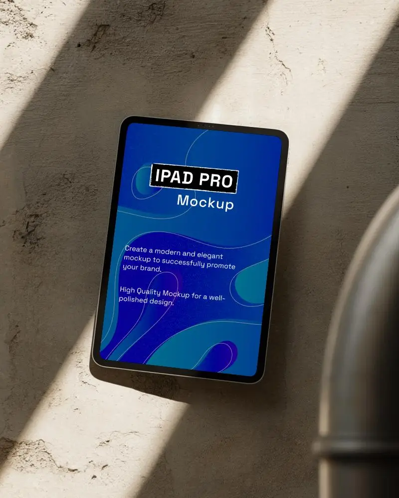 Flat Ipad Pro Mockup Against Rustic Light Wall With Soft Industrial Vibe