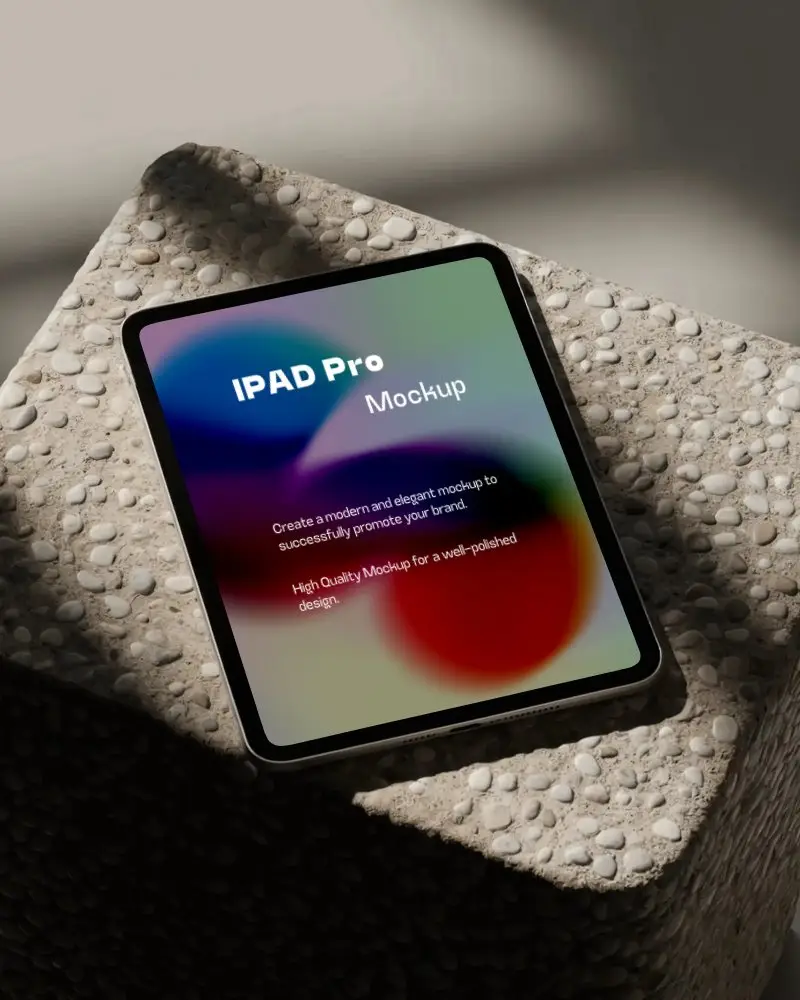 Ipad Pro Mockup Top View On Pebble Textured Stone Block In Soft Daylight