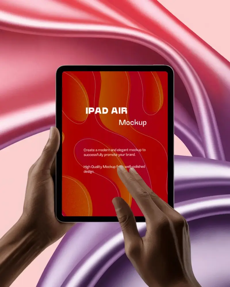 Ipad Air Mockup Hands Holding And Touching Screen With Flowing Red And Purple Satin Background