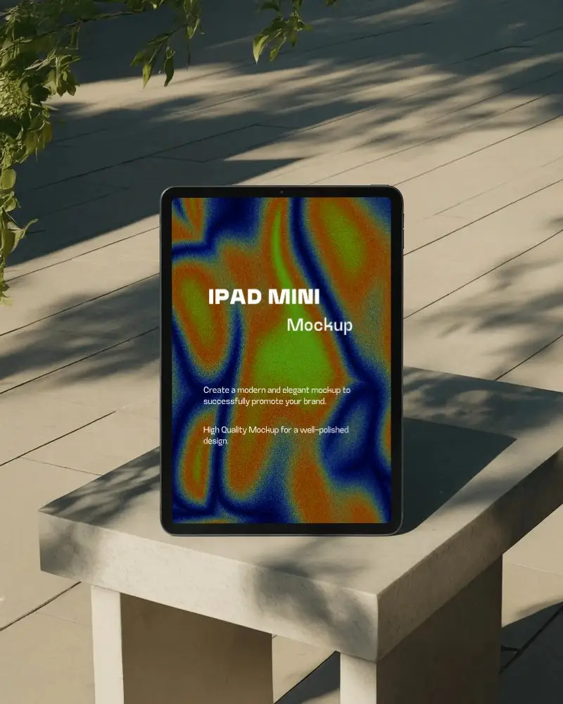 Ipad Mini Mockup Upright On Stone Bench In Sunlit Outdoor Setting With Leaf Shadows