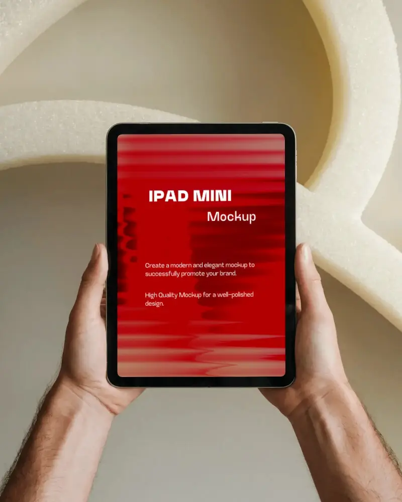 Ipad Mini Mockup Handheld Upright In Front Of Abstract Foam Structure In Modern Studio Light