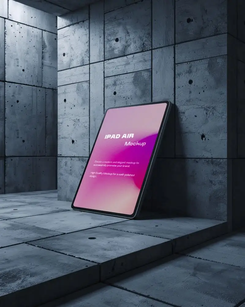 dark-concrete-ipad-air-mockup-leaning-against-industrial-wall-in-blue-toned-studio-lighting