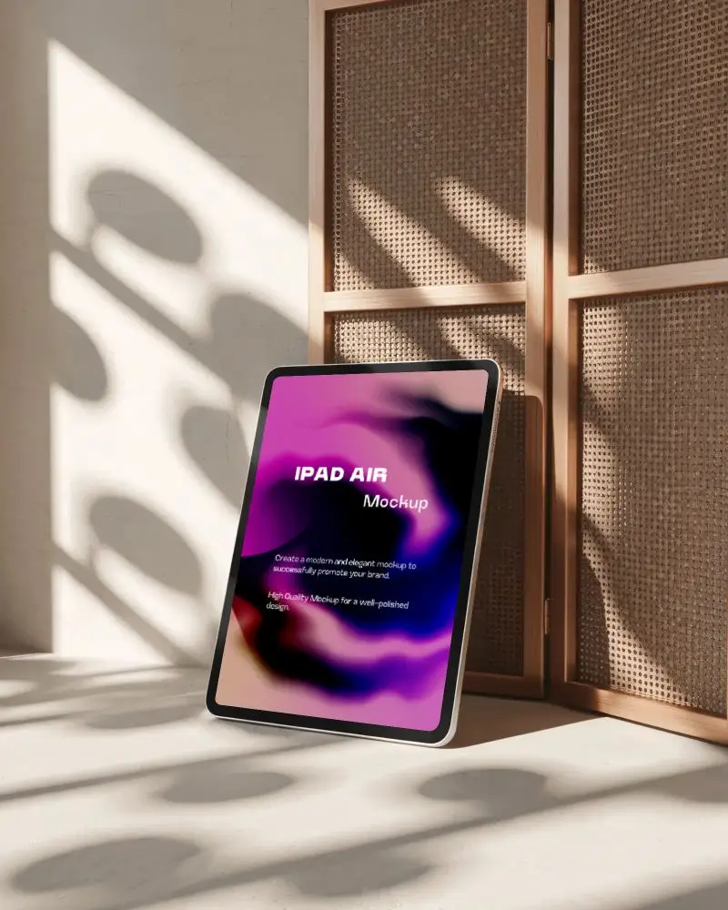 ipad-air-mockup-in-warm-studio-lighting-leaning-against-rattan-panel-with-soft-shadow-play
