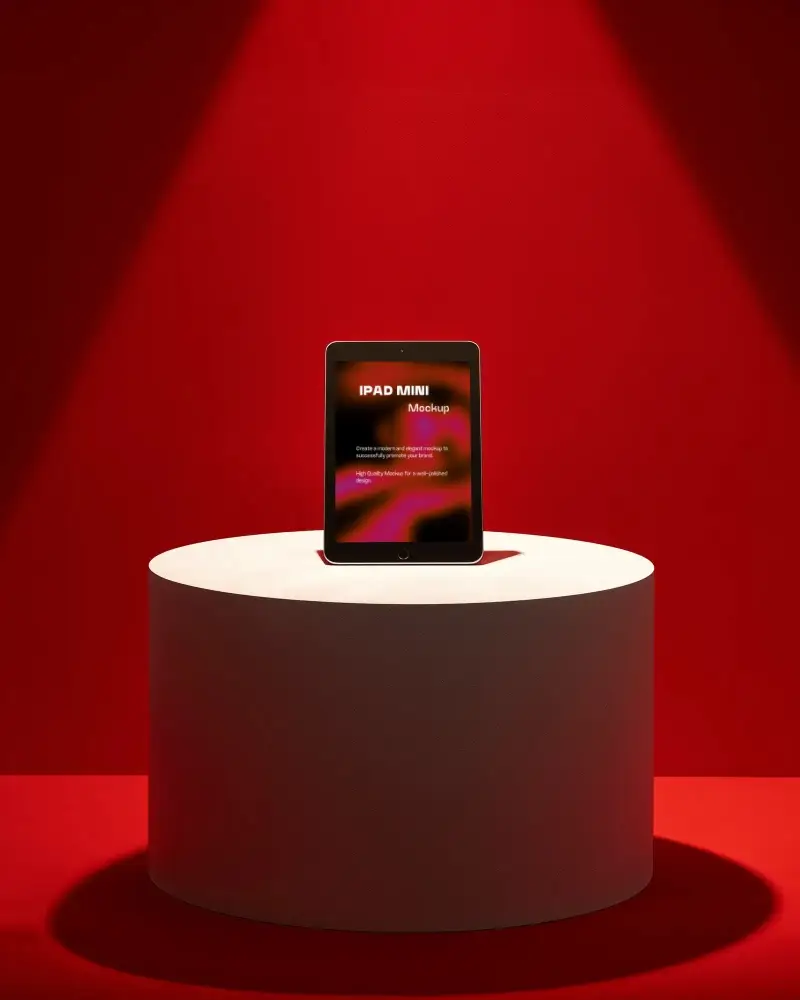 minimalist-ipad-mini-mockup-on-round-pedestal-under-spotlight-in-studio-with-bold-red-background