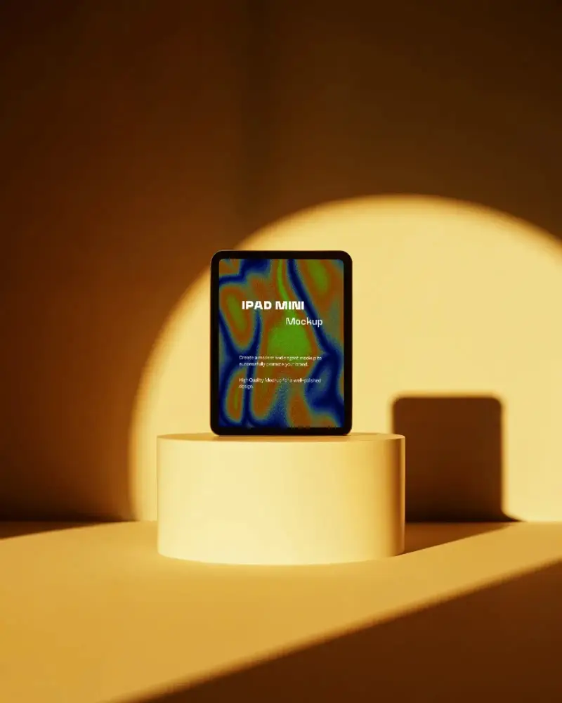 ipad-mini-mockup-standing-on-round-pedestal-in-warm-golden-light-with-modern-studio-background
