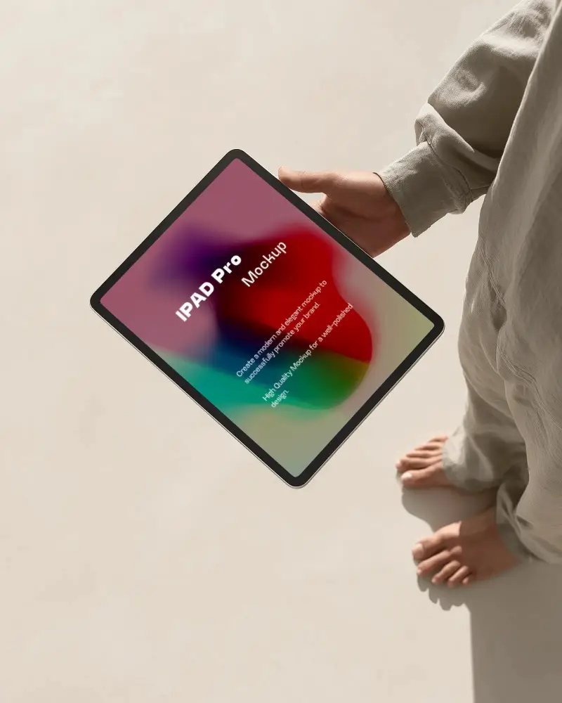 Ipad Pro Mockup Handheld Sideways In Minimal Studio Scene With Barefoot Model