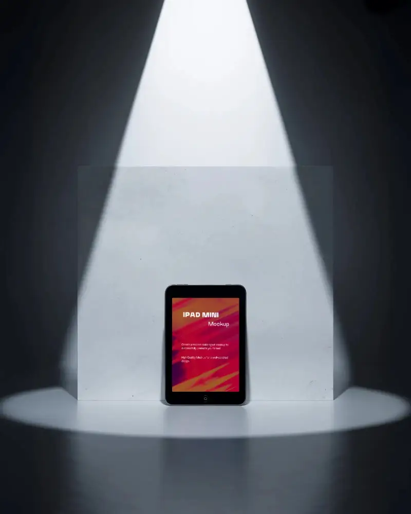 Dramatic Ipad Mini Mockup Digital Tablet In Spotlight Against Minimal Block Background Dark Studio