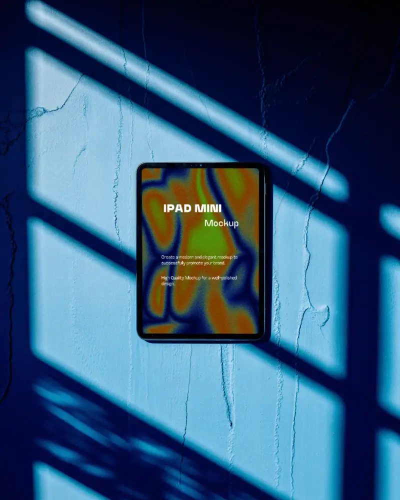 Sleek Ipad Mini Mockup On Cracked Wall With Dramatic Light And Shadow Pattern For Showcase