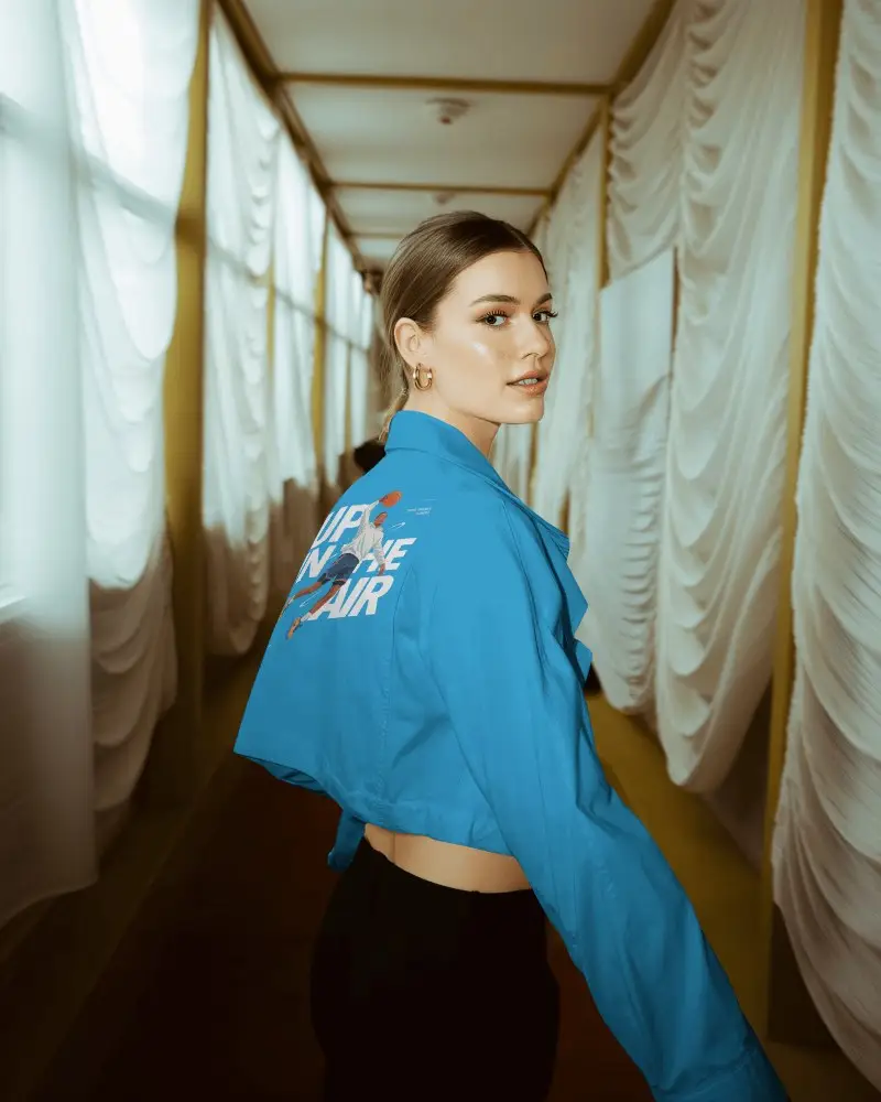 Stylish Short Jacket Mockup On Model In Draped Corridor Modern Chic Portrait