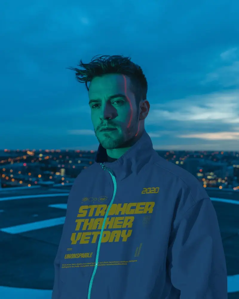 Neon Horizon Urban Bomber Jacket Mockup Male Model On Rooftop With City Lights At Dusk