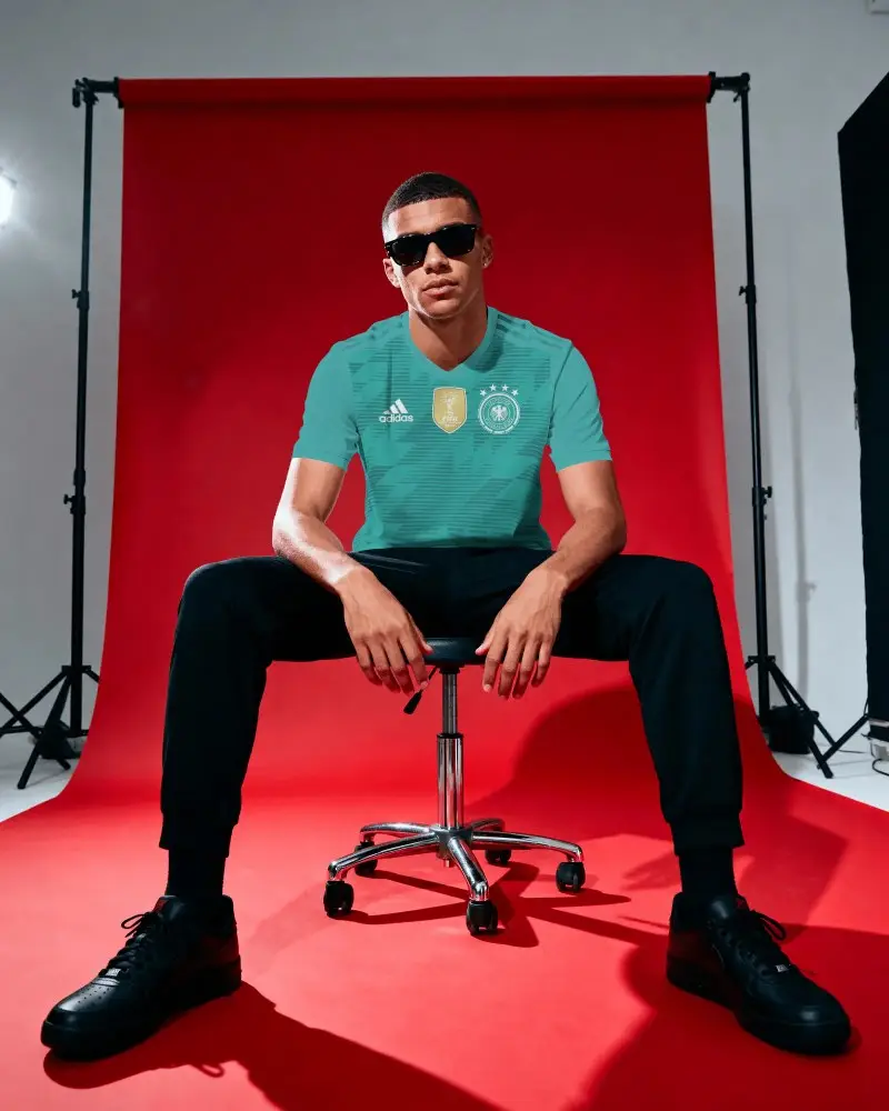 Modern Athlete Wearing Sporty Short Sleeve Jersey Mockup For Design Presentation