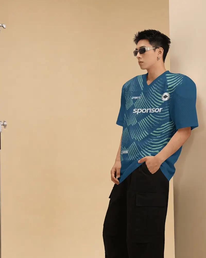 Beige Studio Hockey Jersey Mockup Male Model Side Pose With Sunglasses And Streetwear Styling