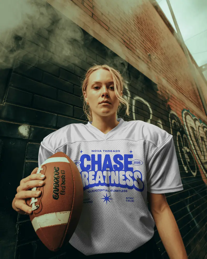 Urban Football Jersey Mockup Female Player Holding Ball In Smoky Alleyway