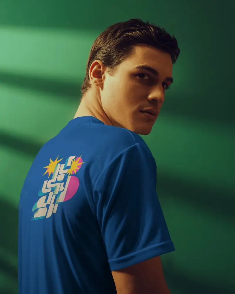 Modern Portrait Jersey Mockup Male Model In Warm Light Against Green Backdrop