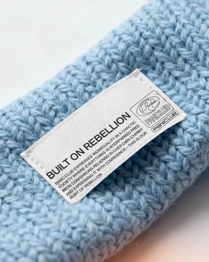 Close Up Of Blank Fabric Label On Knitwear Showcasing Texture And Stitching Detail
