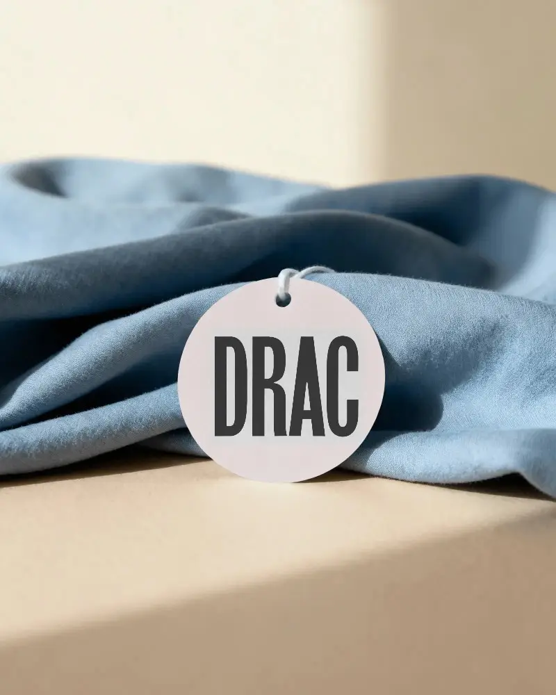 Blank Round Hanging Label On Soft Fabric Texture Background Minimalist Product Tag Design