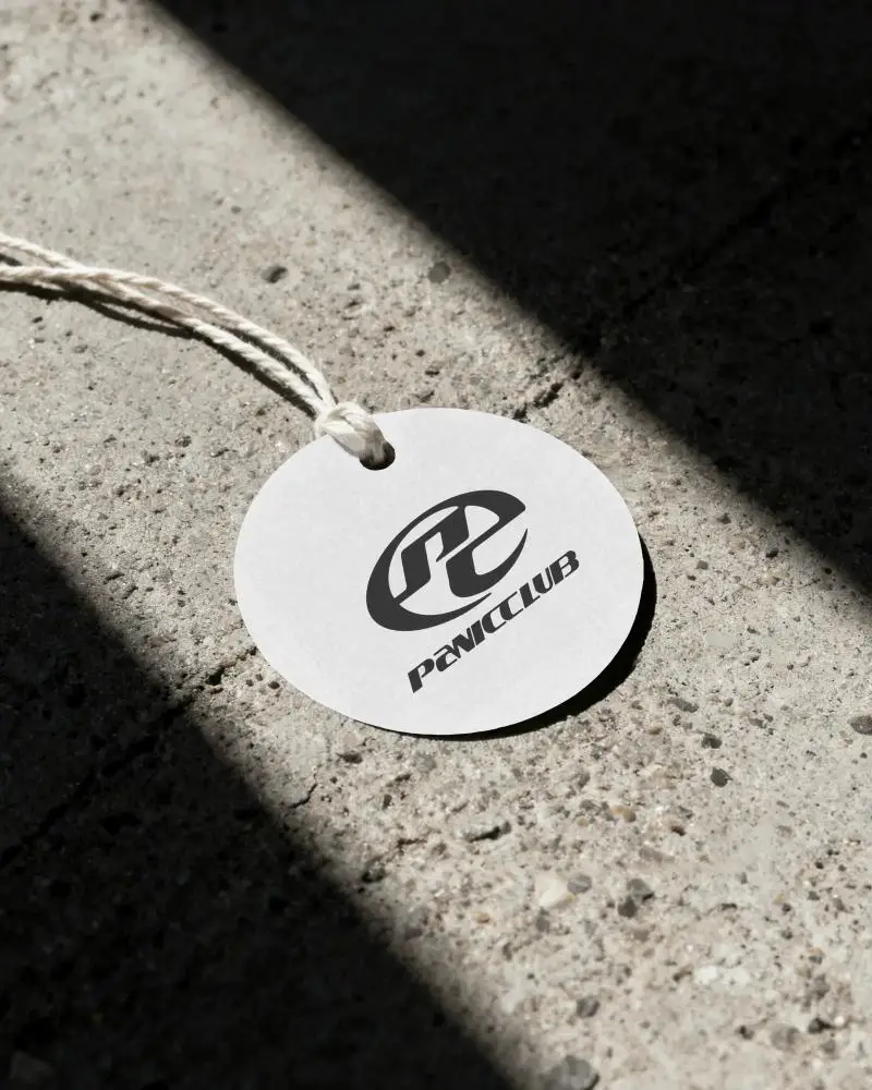 Blank Round Hanging Label Mockup On Natural Twisted String On Concrete Surface Shadow