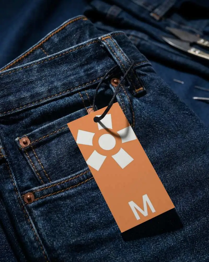 Apparel Label Mockup Attached To Pocket Of Casual Jeans For Custom Logo Or Text Display