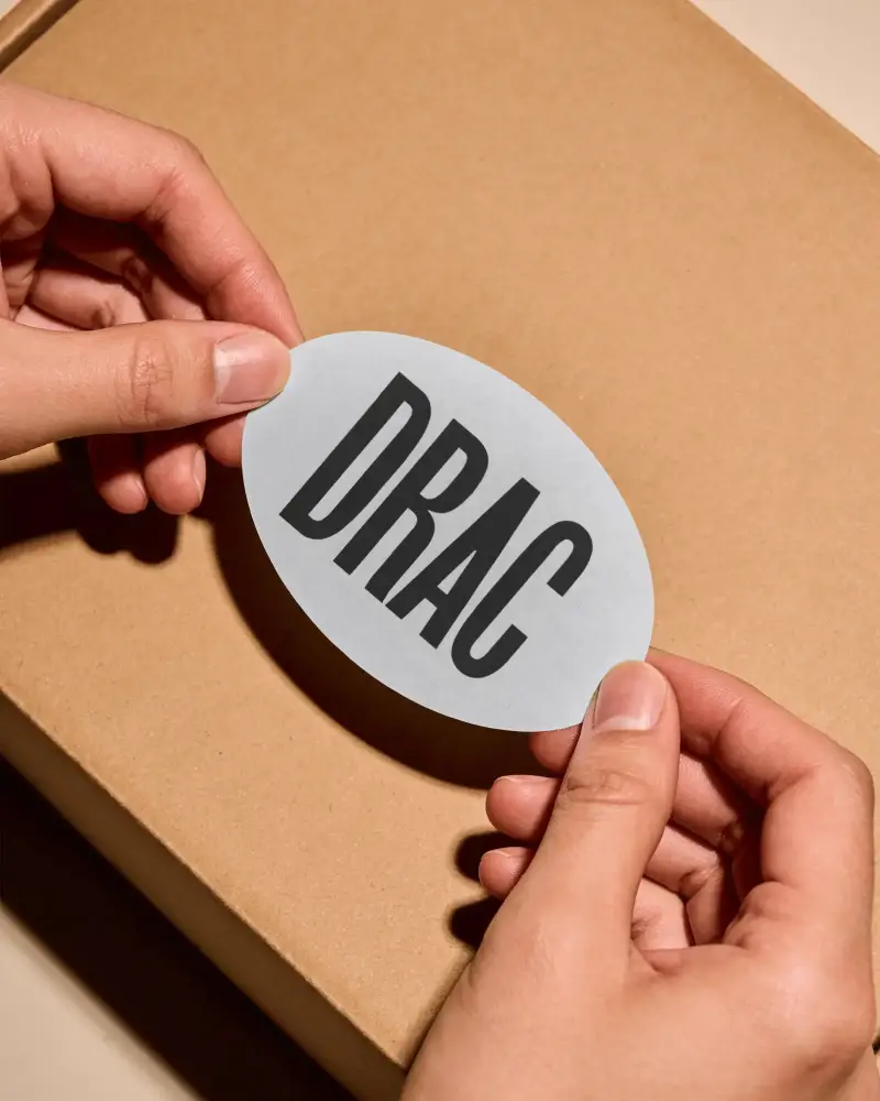 Realistic Oval Cardboard Box Label Mockup Hands Holding For Packaging Branding Showcase