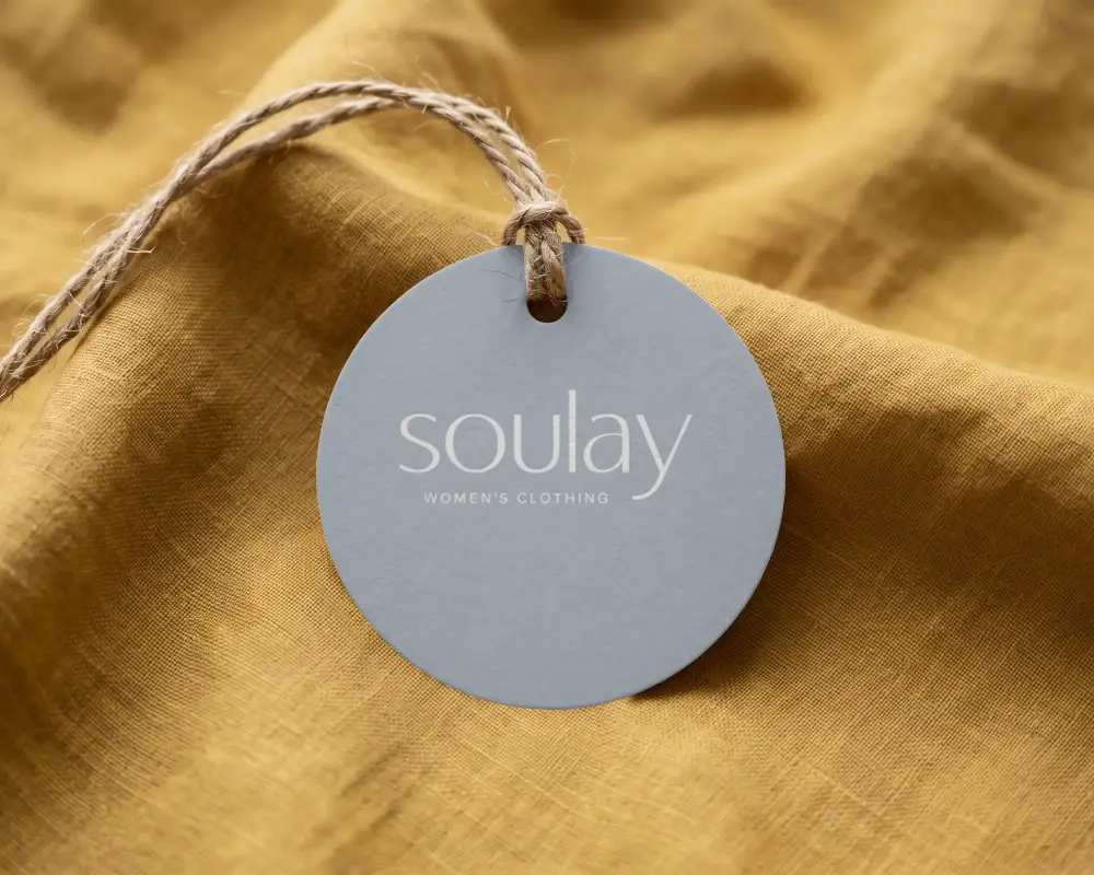 Minimalist Suspended Round Label Mockup With Twine String On Light Fabric Texture