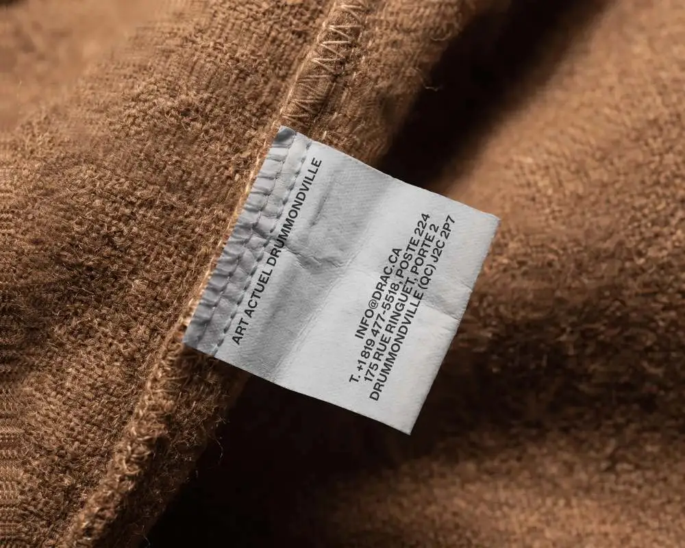 Blank Woven Label Mockup On Soft Fabric Texture For Apparel Branding And Packaging Design