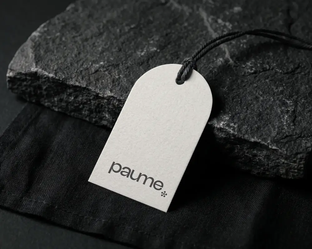 Elegant Blank Arch Shape Clothing Lable Mockup With String On Natural Stone Background For Marketing